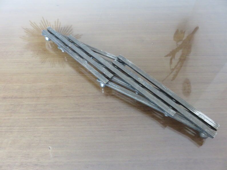 Extendable silver metal underside 40s 50s