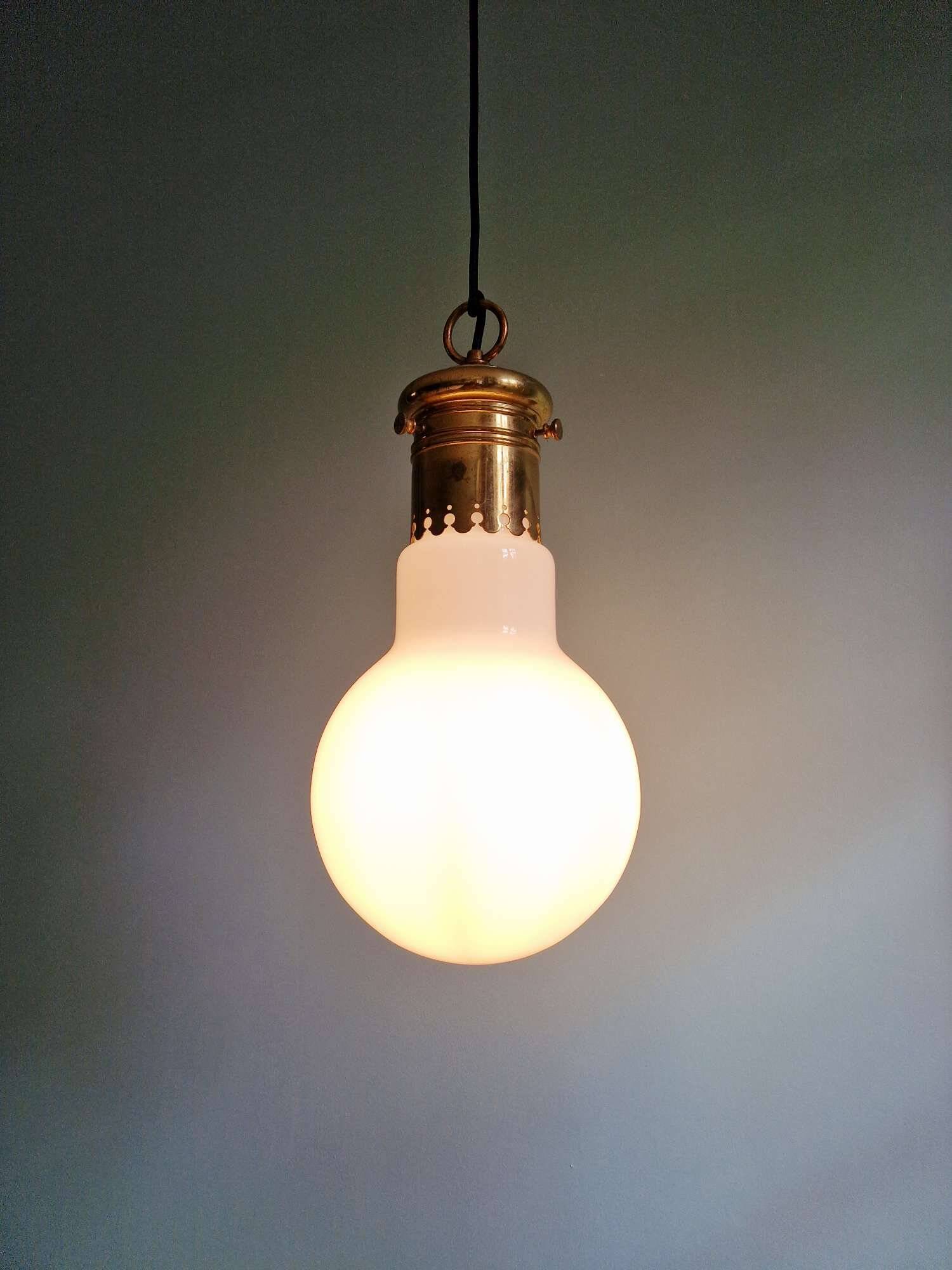Large bulbous pendant light in white opaline and brass