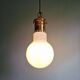 Large bulbous pendant light in white opaline and brass