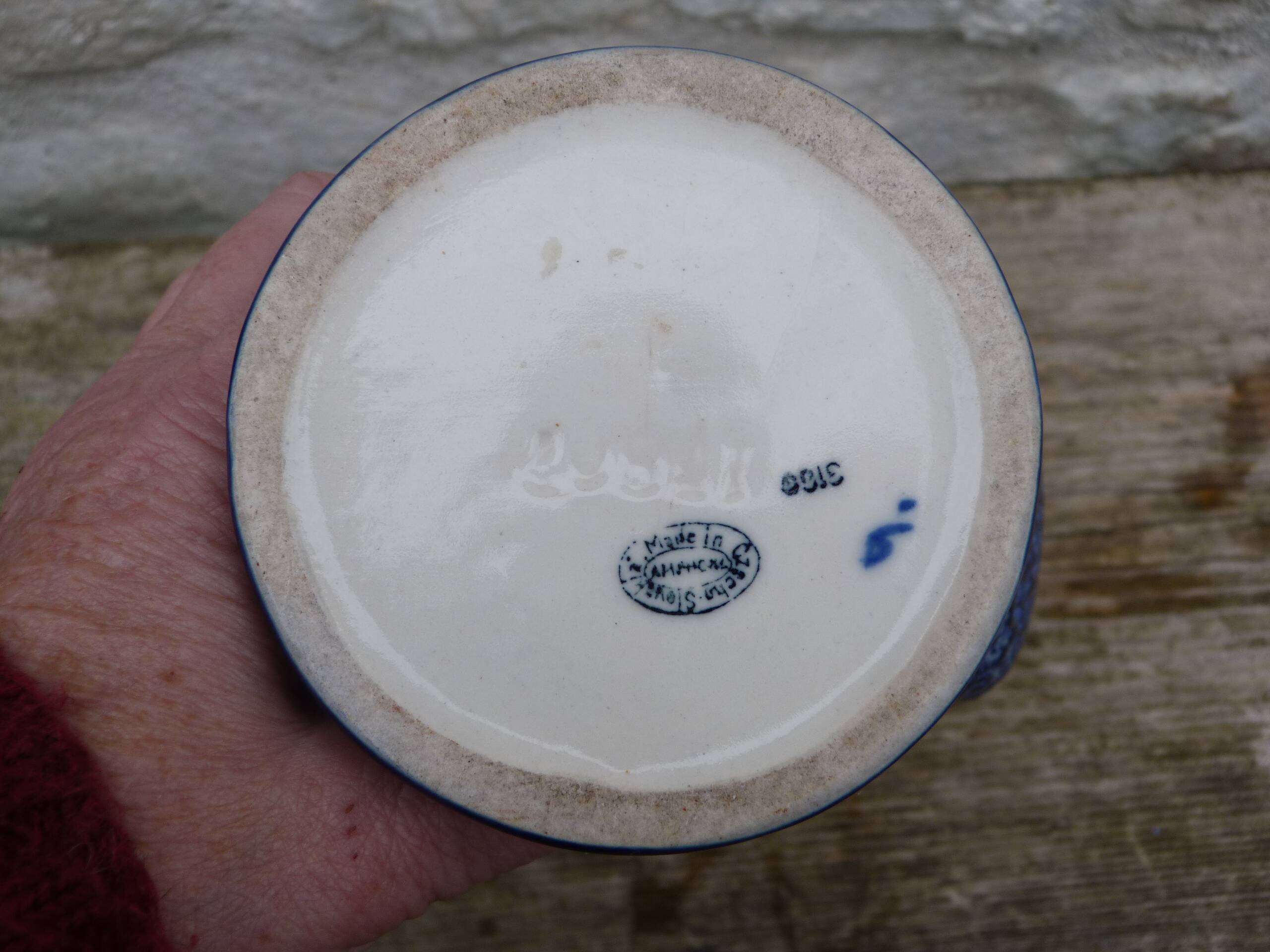 Blue ceramic vase with floral motifs