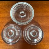 Set of three round thick moulded glass candle holders