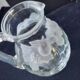 Large water jug with embossed fruit decoration in frosted glass