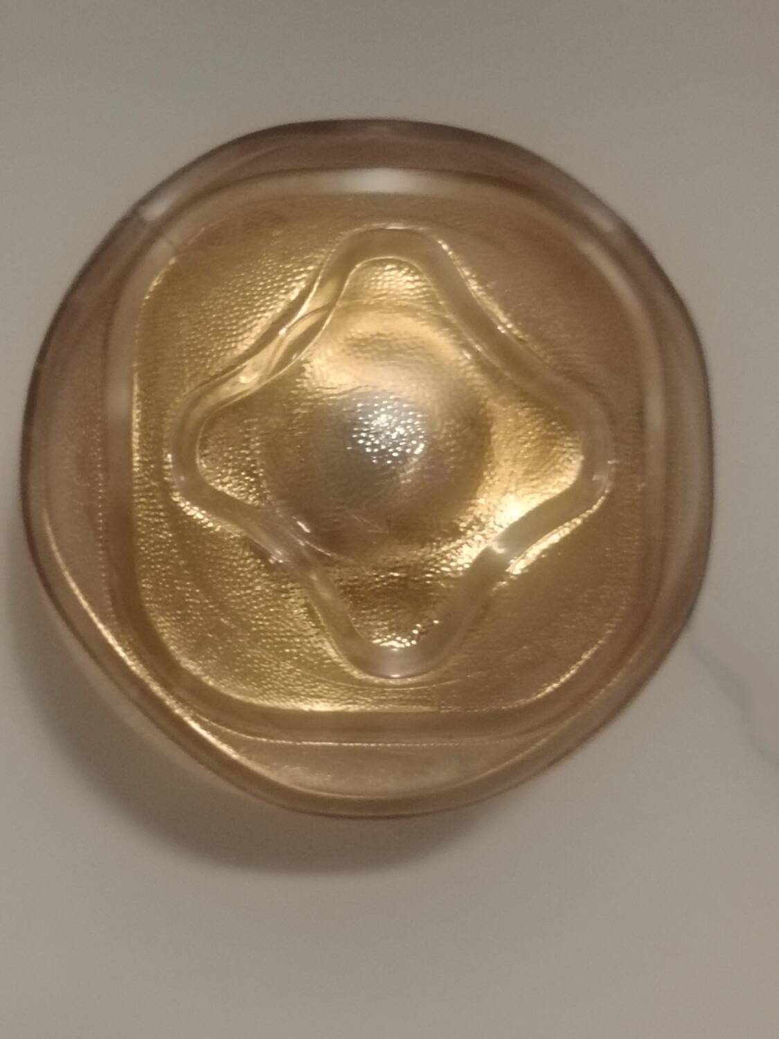 Textured amber globe wall light