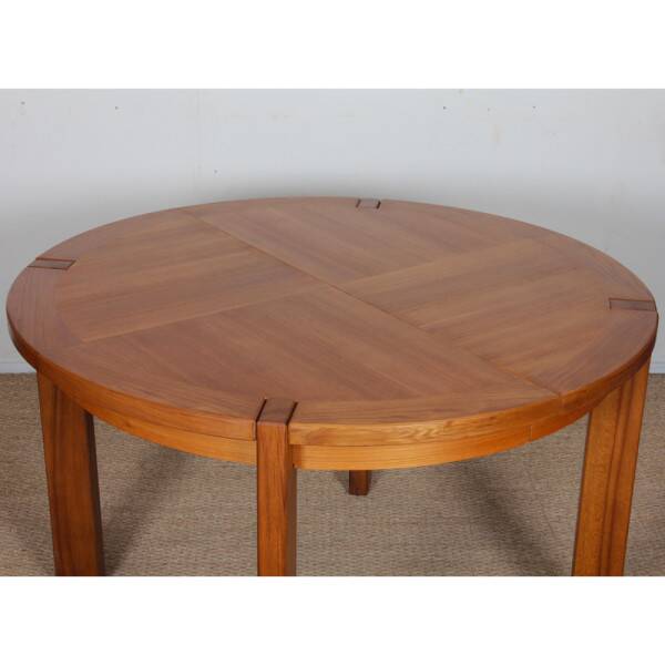 Round extendable dining table in wood published by Monopoly, 1970.