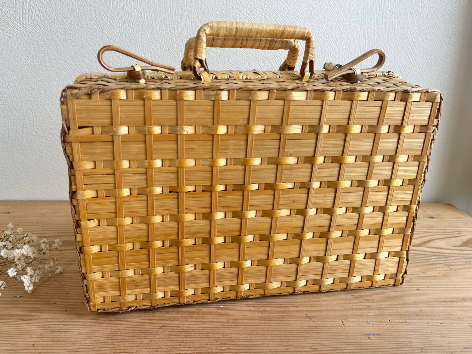Vintage woven wicker suitcase