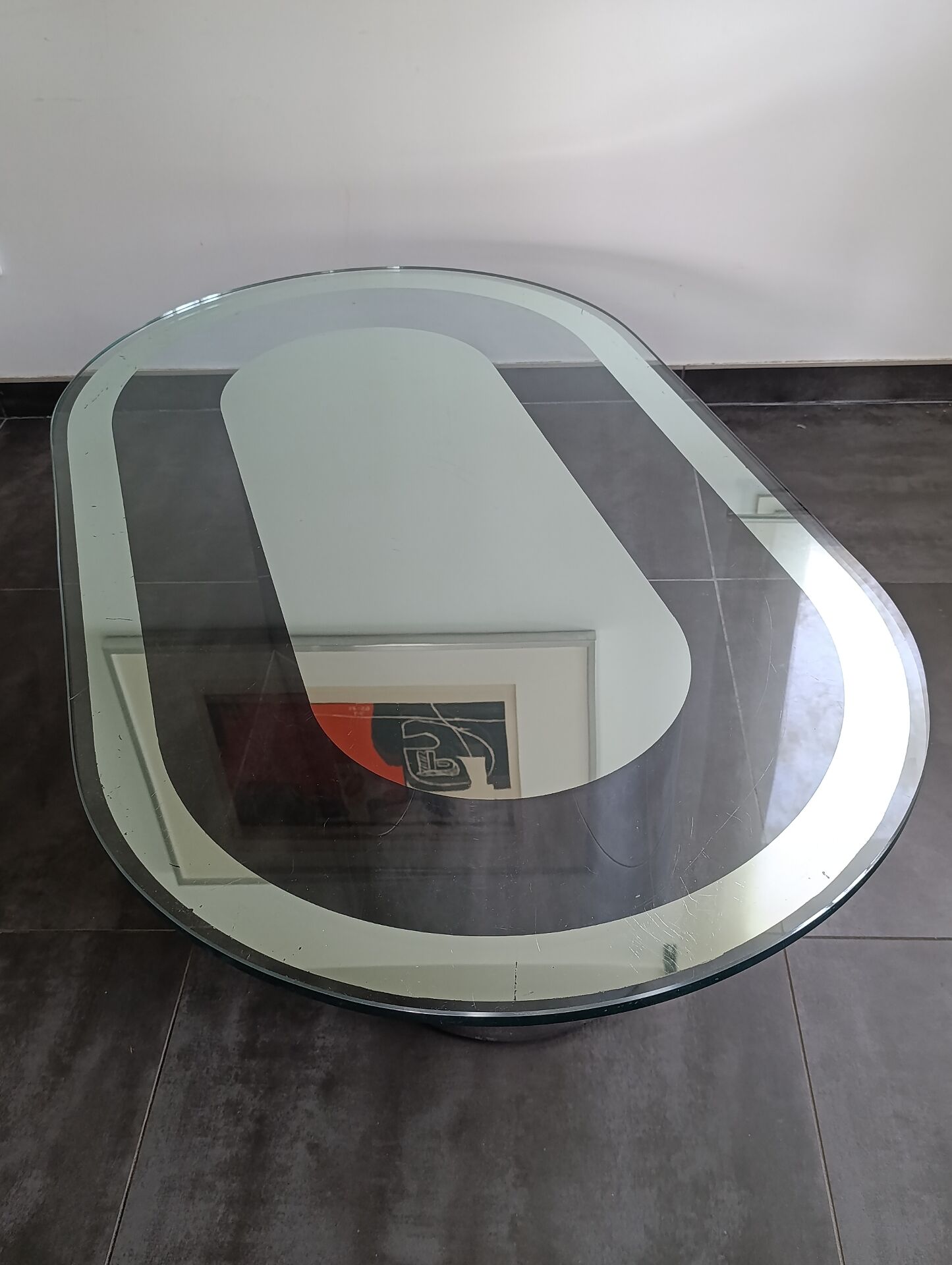 Vintage coffee table with glass and chrome metal.