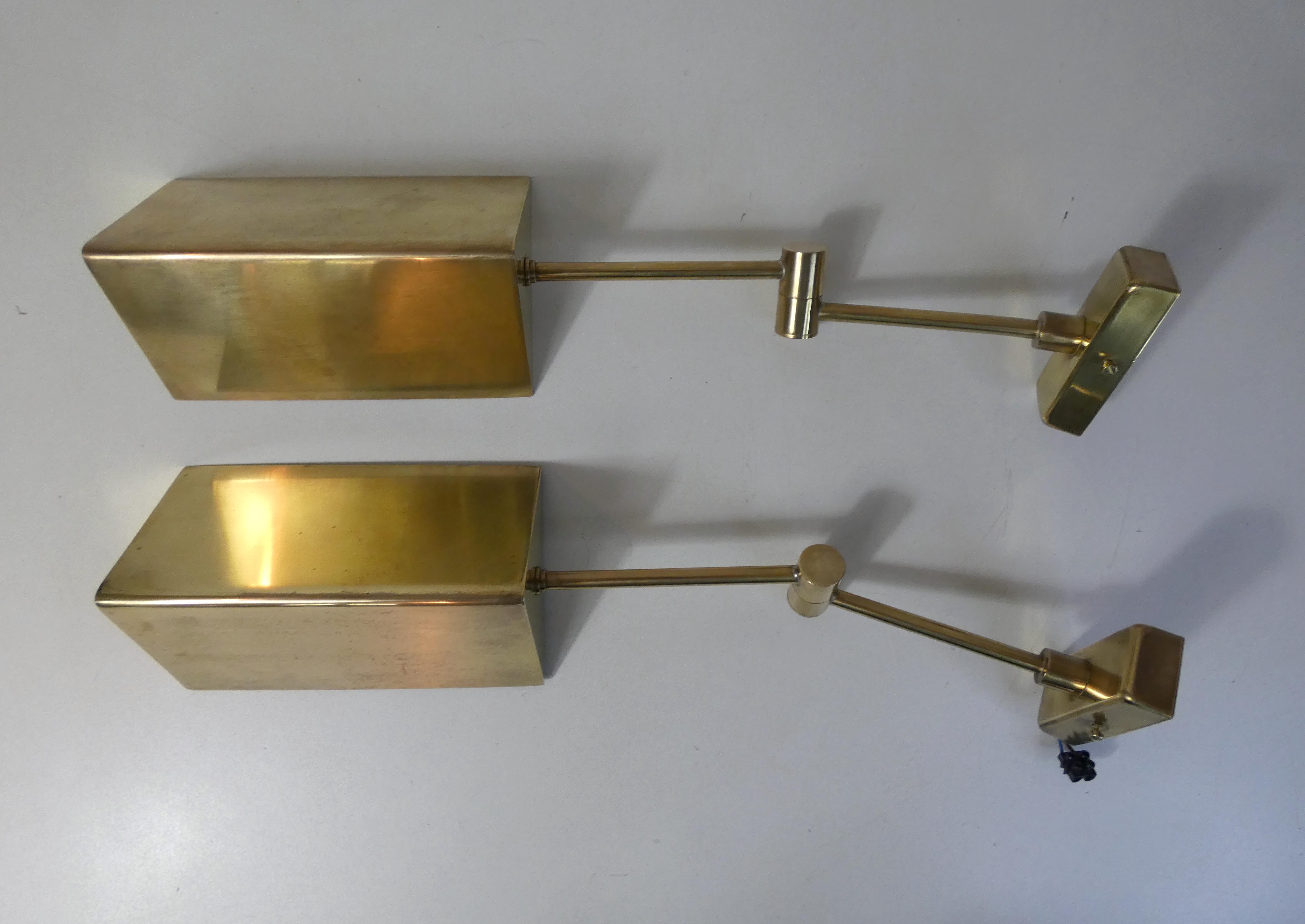 Pair of adjustable brass wall lamps after koch & lowy