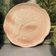 Old flat plate in the shape of saline pink fish baths made in France