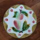 Assiette ancienne en barbotine
