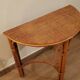 Rattan half-moon console