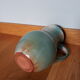 Pitcher with handle green celadon turquoise and caramel