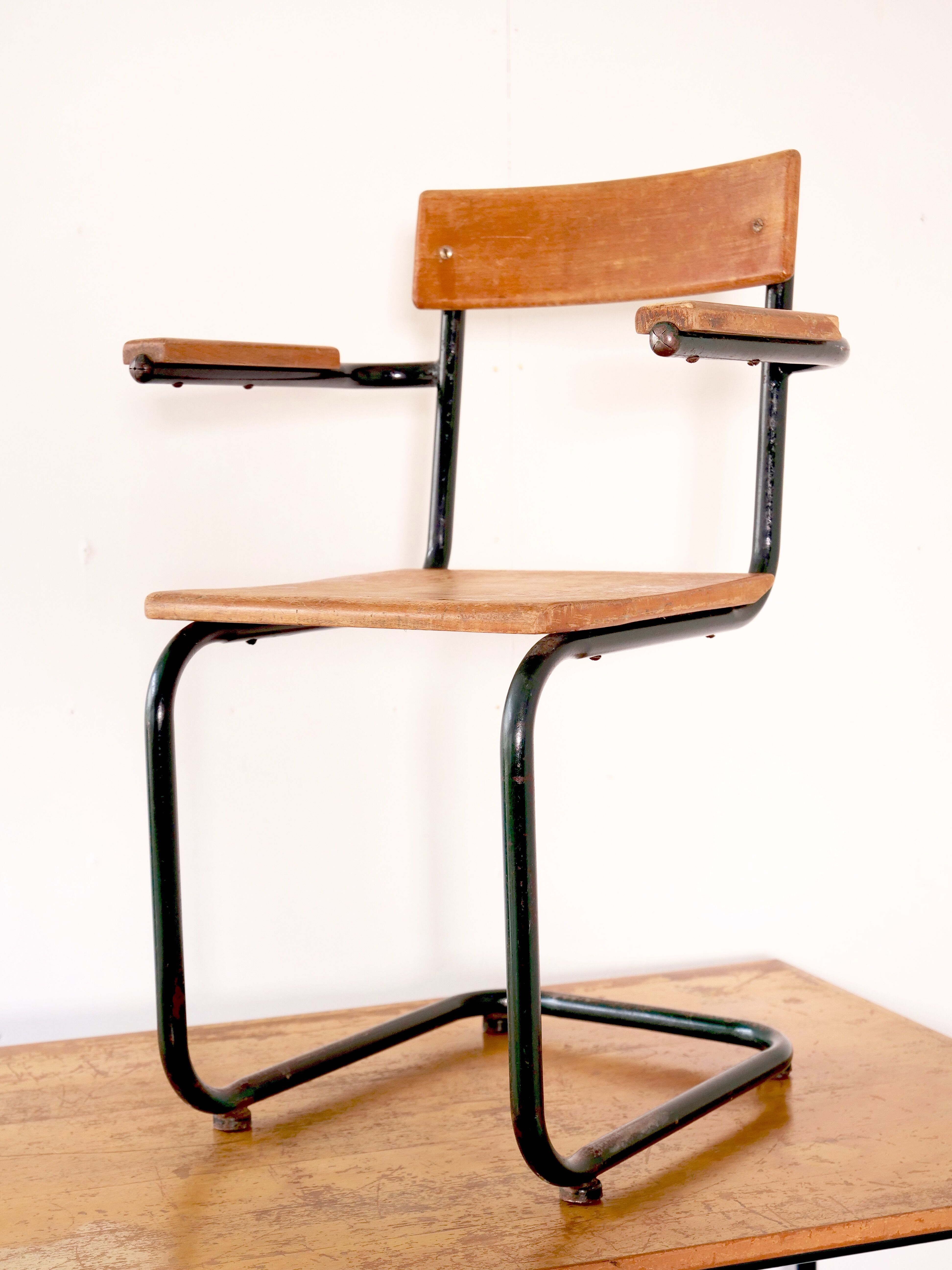 Desk with bauhaus style tubular steel chair