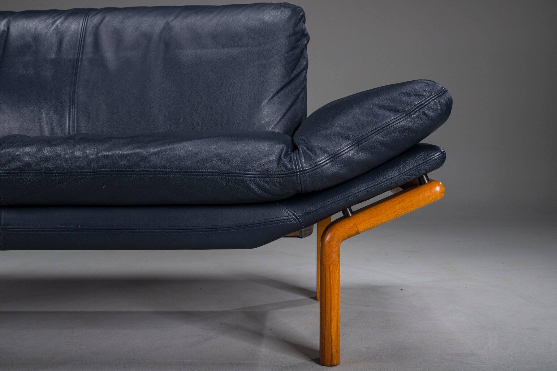 Danish teak and navy blue leather 2-seater sofa from Komfort, 1970s