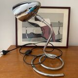 Chrome table lamp with spiral base and adjustable head. Halo brand
