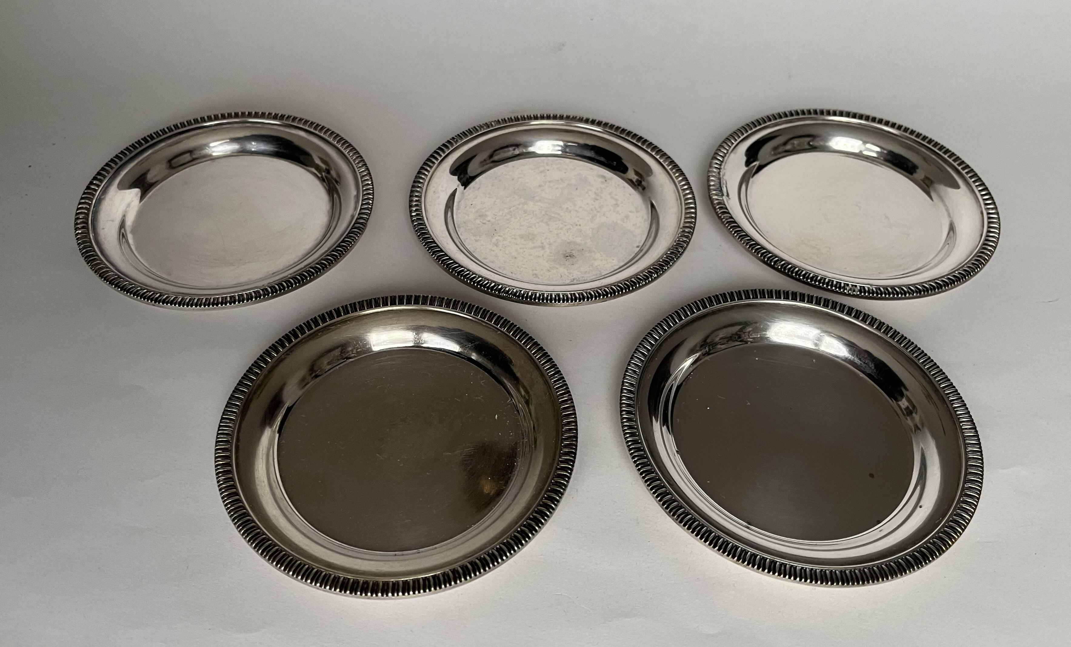 Set of 5 silvered metal coasters