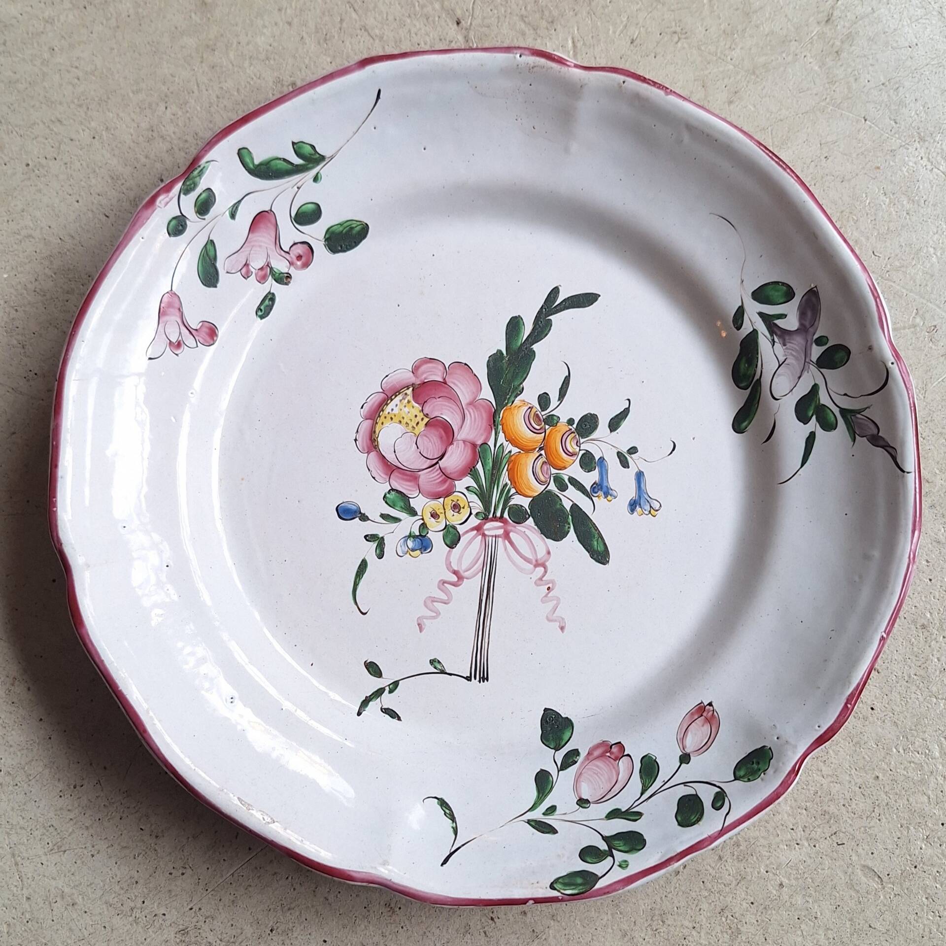 Hand-painted earthenware plate from eastern France, 18th century.