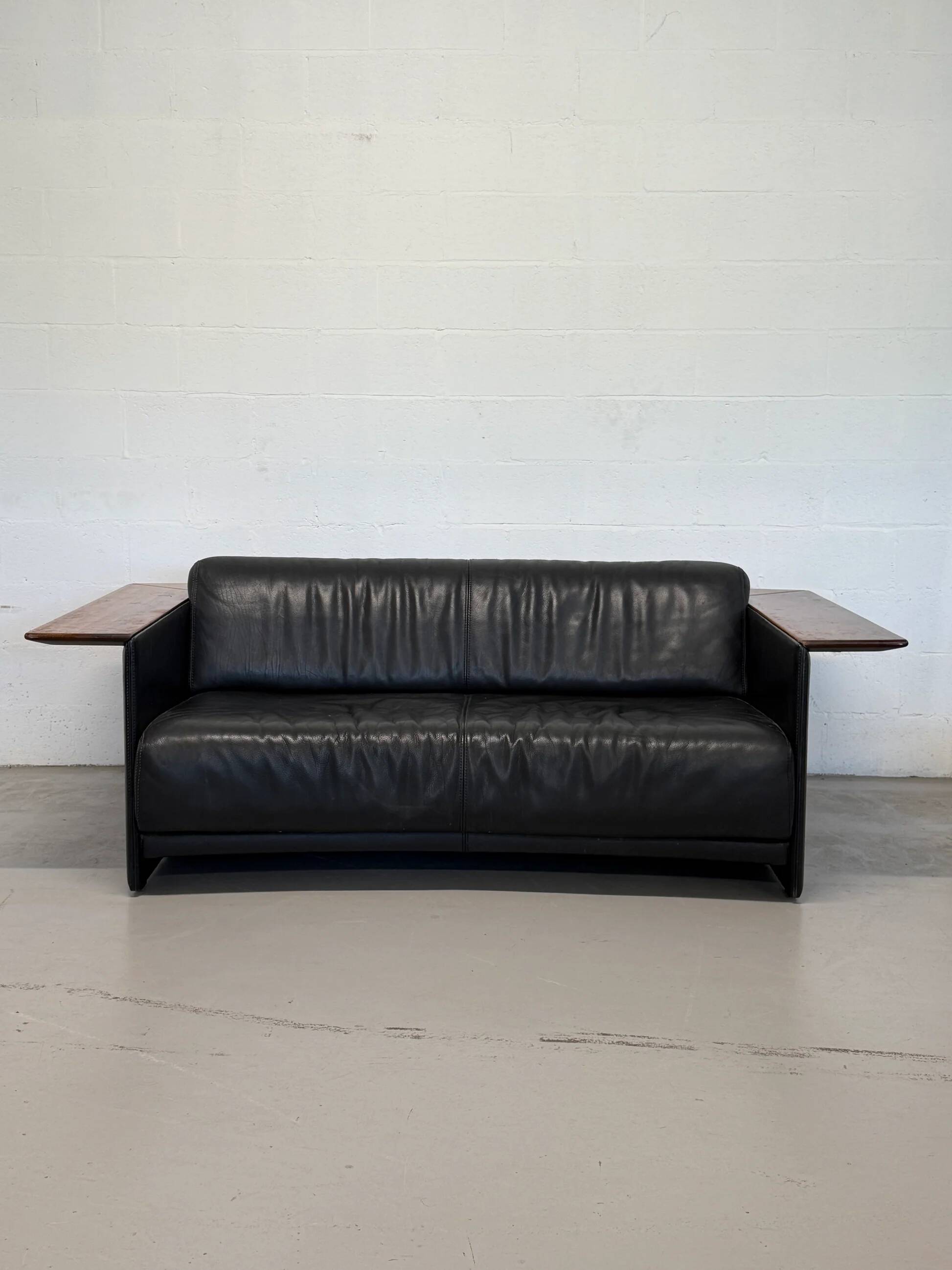 Vintage Black Leather Loveseat with Cantilevered Walnut Tray Arms