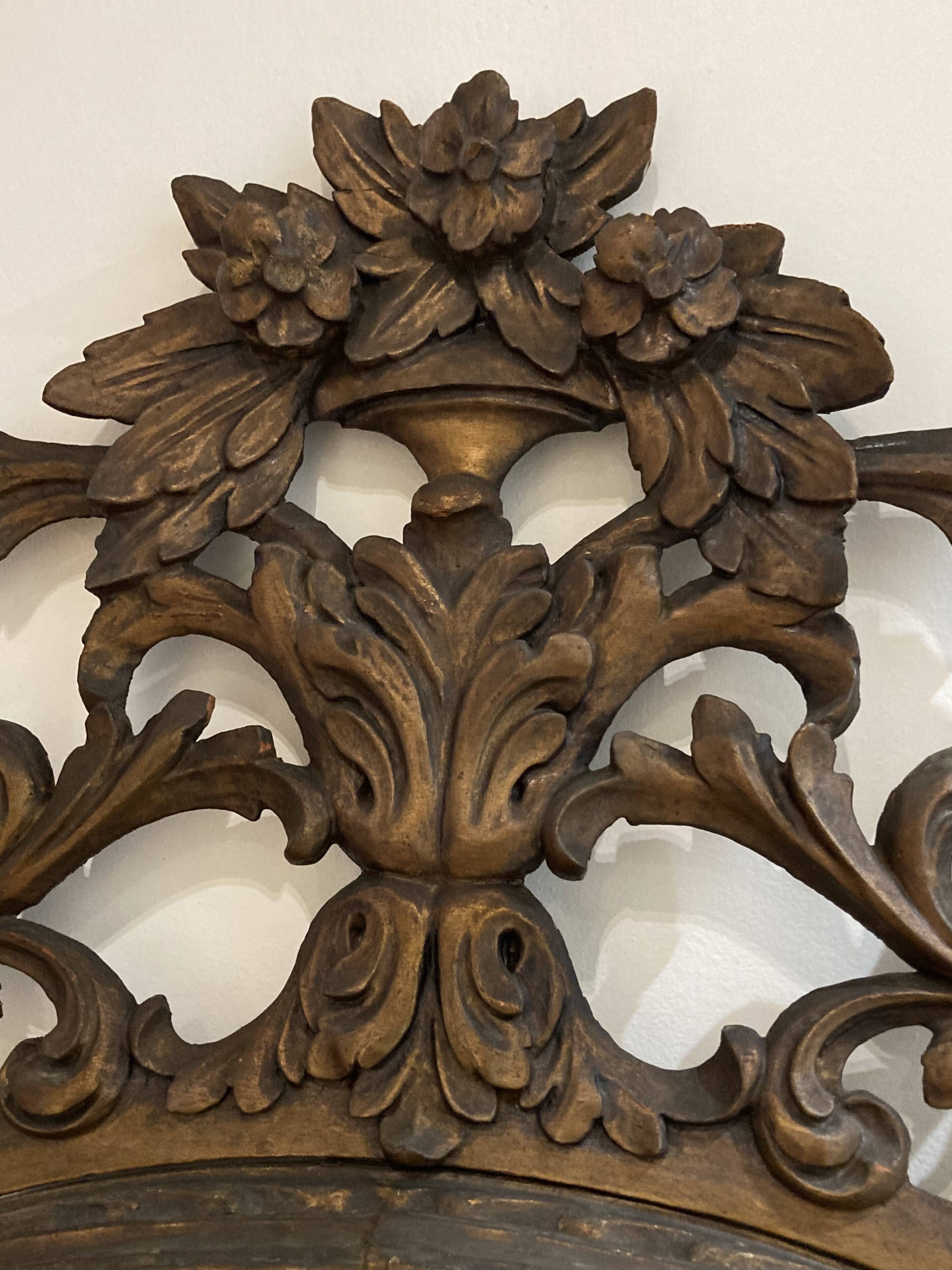 Large mirror or trumeau with beadwork in carved and gilded wood. Italian work from the beginning of the 19th century