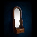 Wall mirror in arched frame with drawer