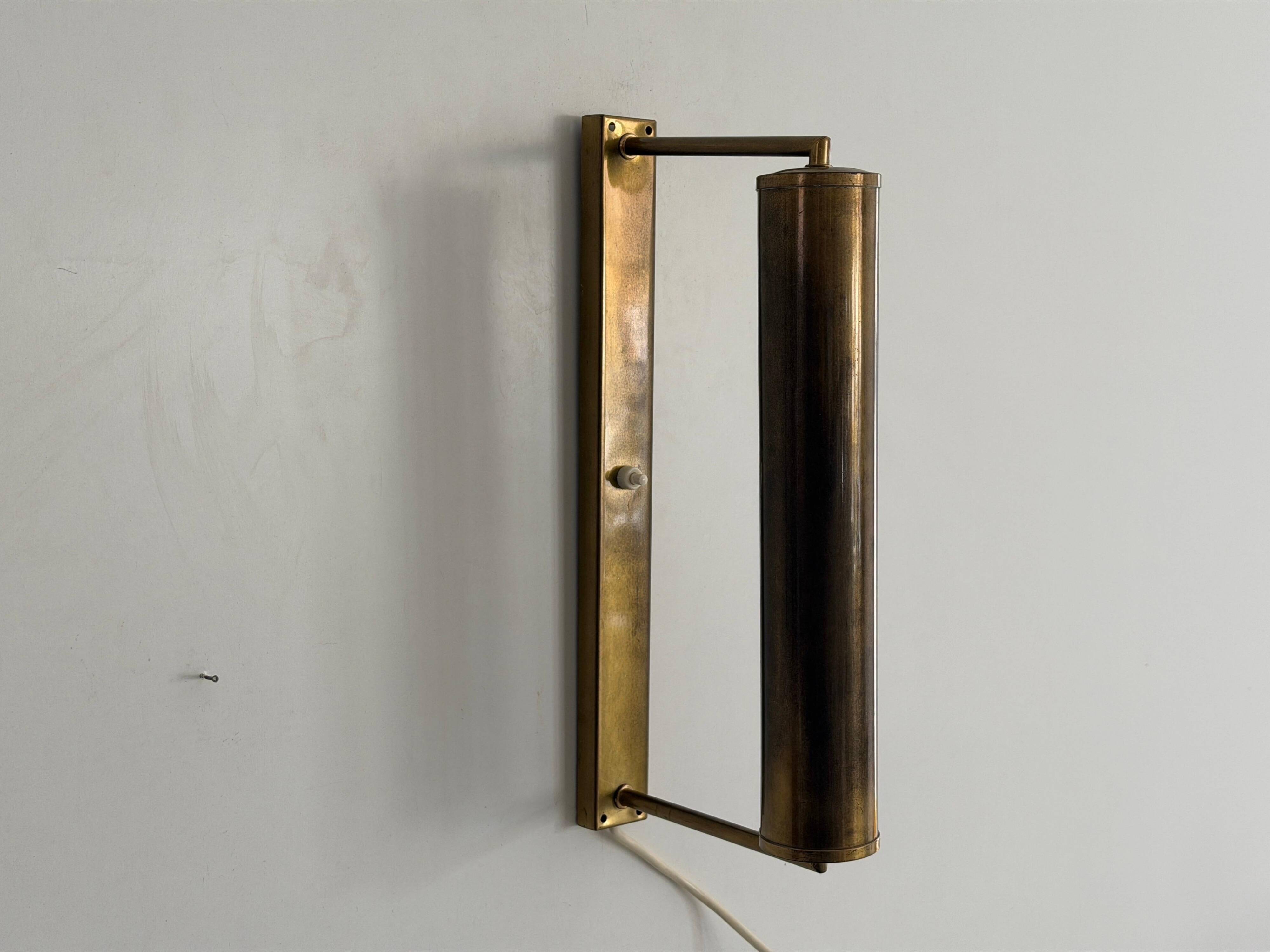 Pair of brass wall lights with adjustable heads from the mid-20th century, 1960, Germany.