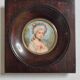 Miniature portrait of a woman in the style of Marie Antoinette, signed Lucia, 12 x 12 cm.
