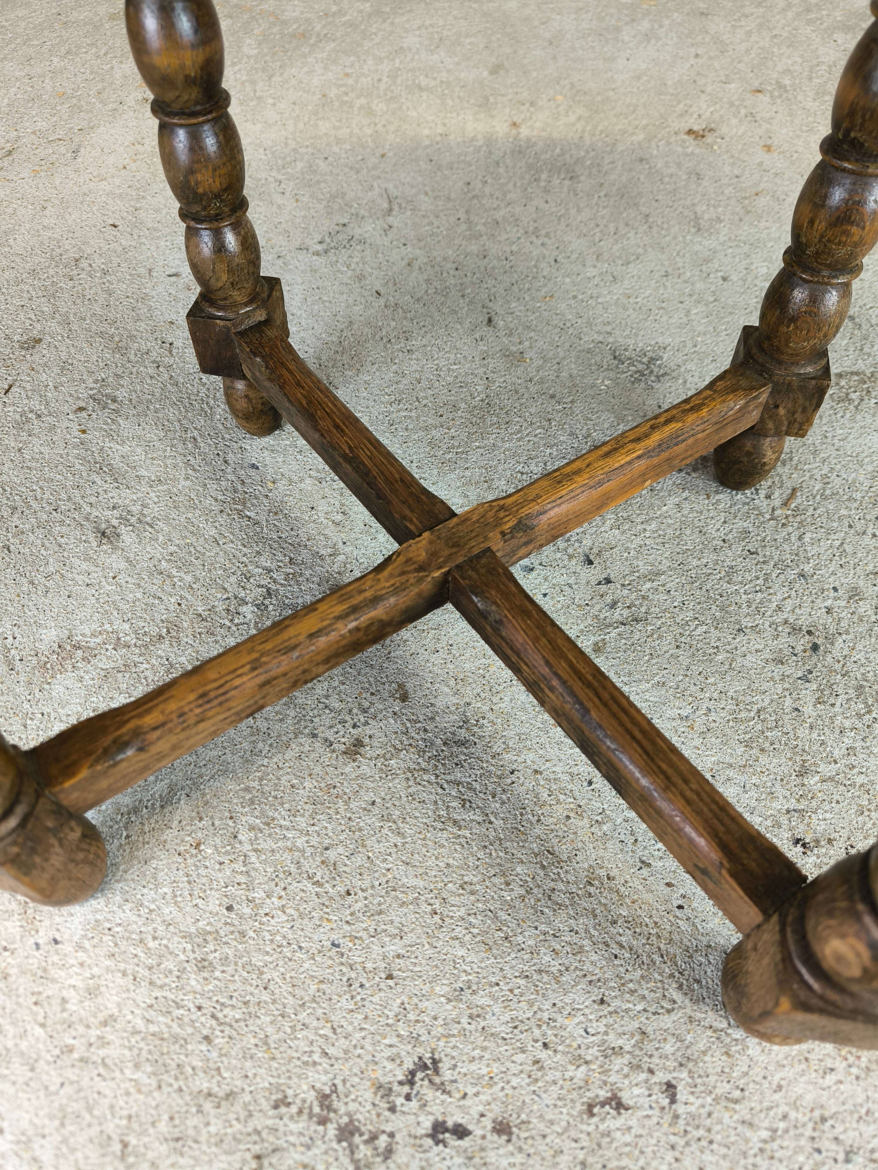 Vintage gueridon with beaded wooden legs.