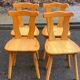 4 rounded Scandinavian dining chairs in solid pine from the 1980s.