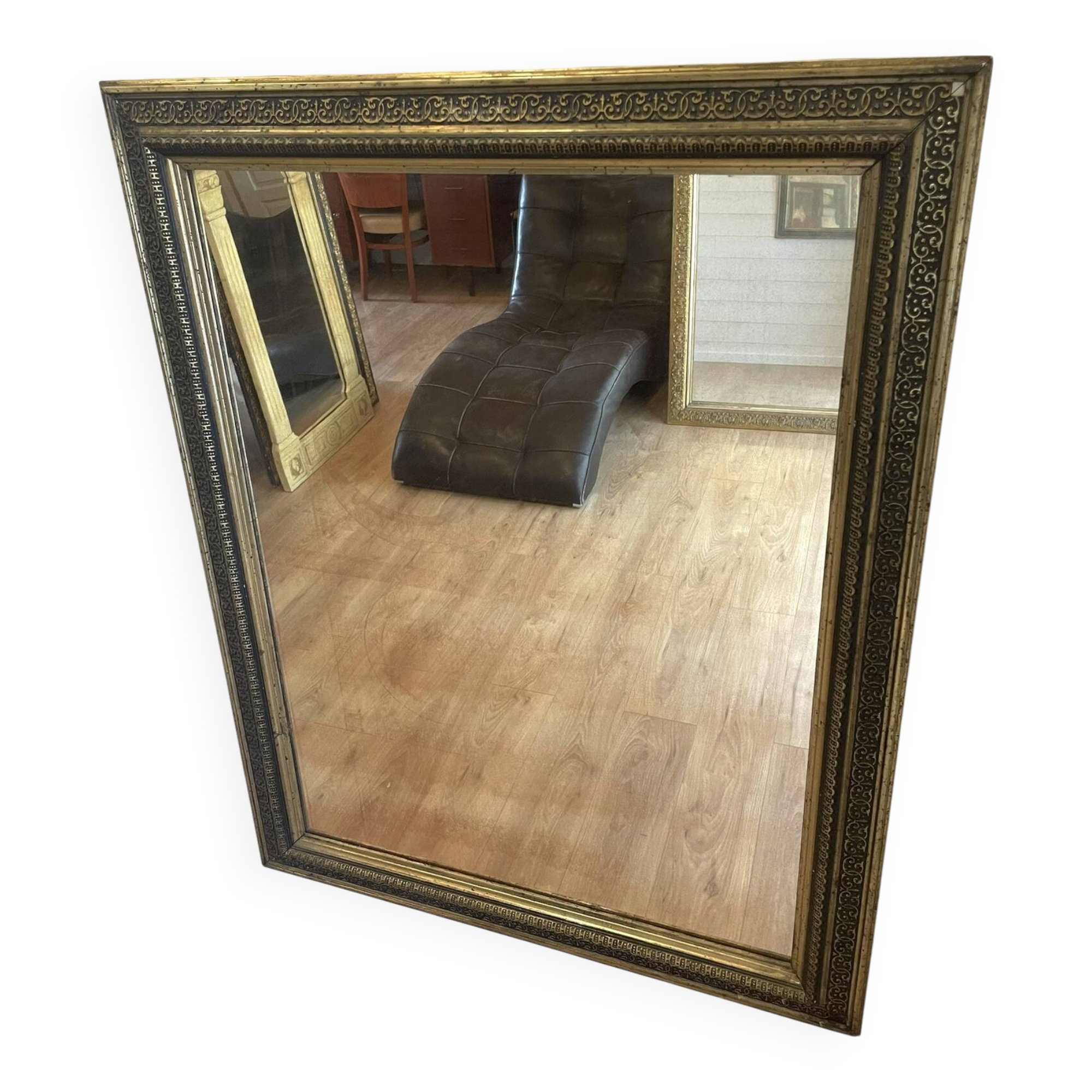 Large gilded antique mirror with moulding in the Napoléon III style.
