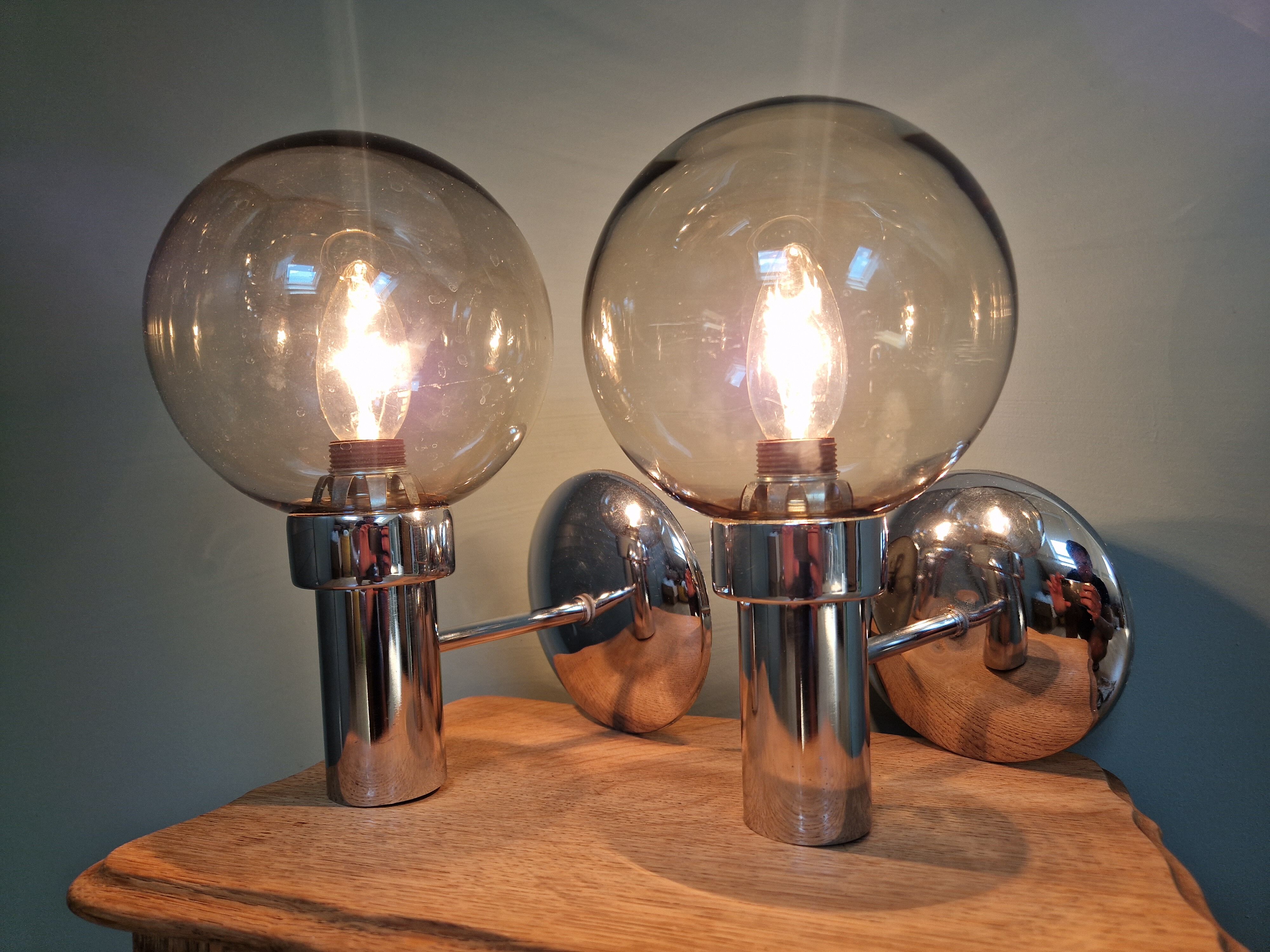 Pair of vintage wall lights in chromed metal and smoked glass, 70s