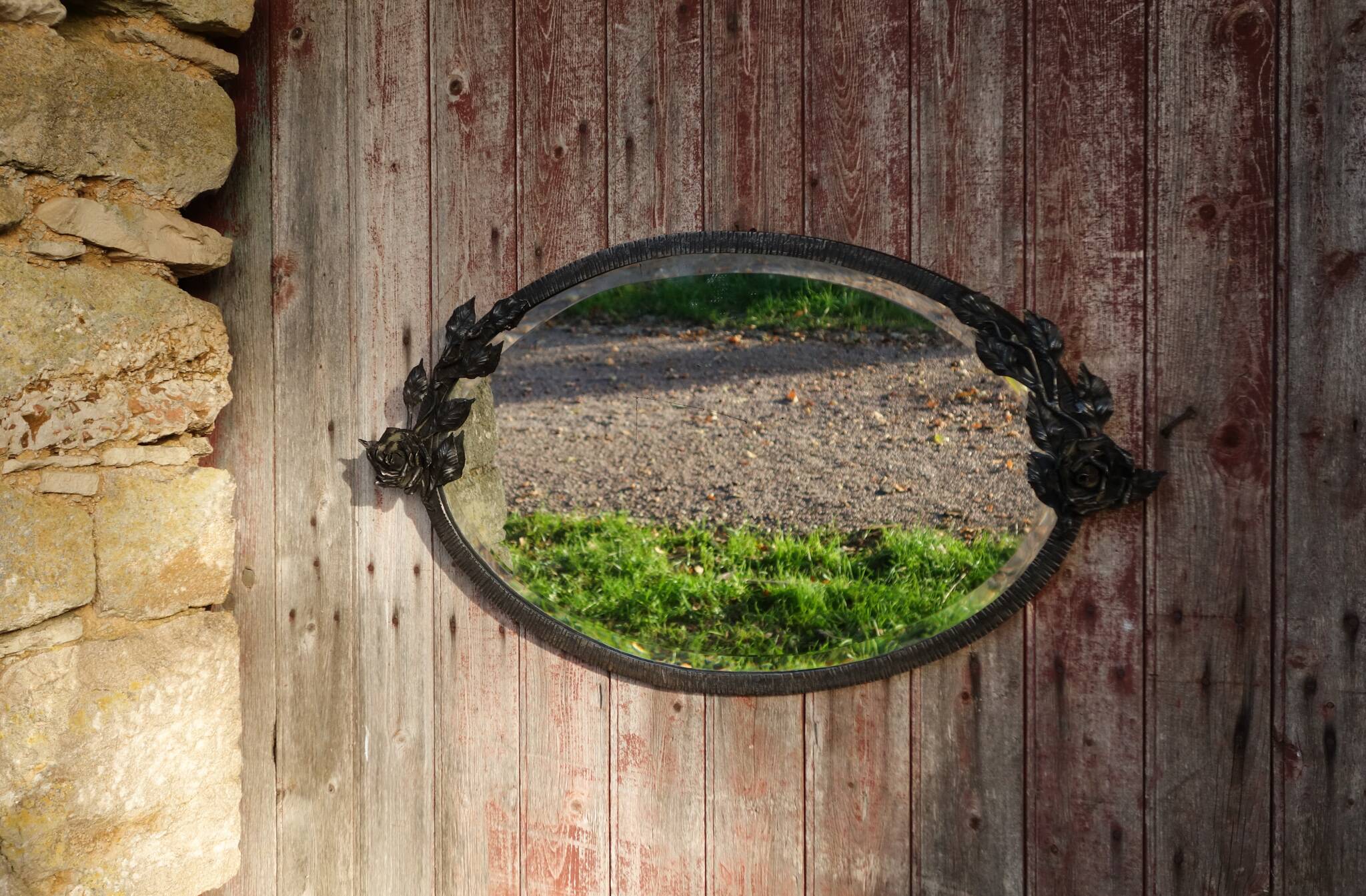 Art Deco mirror in wrought iron and beveled glass