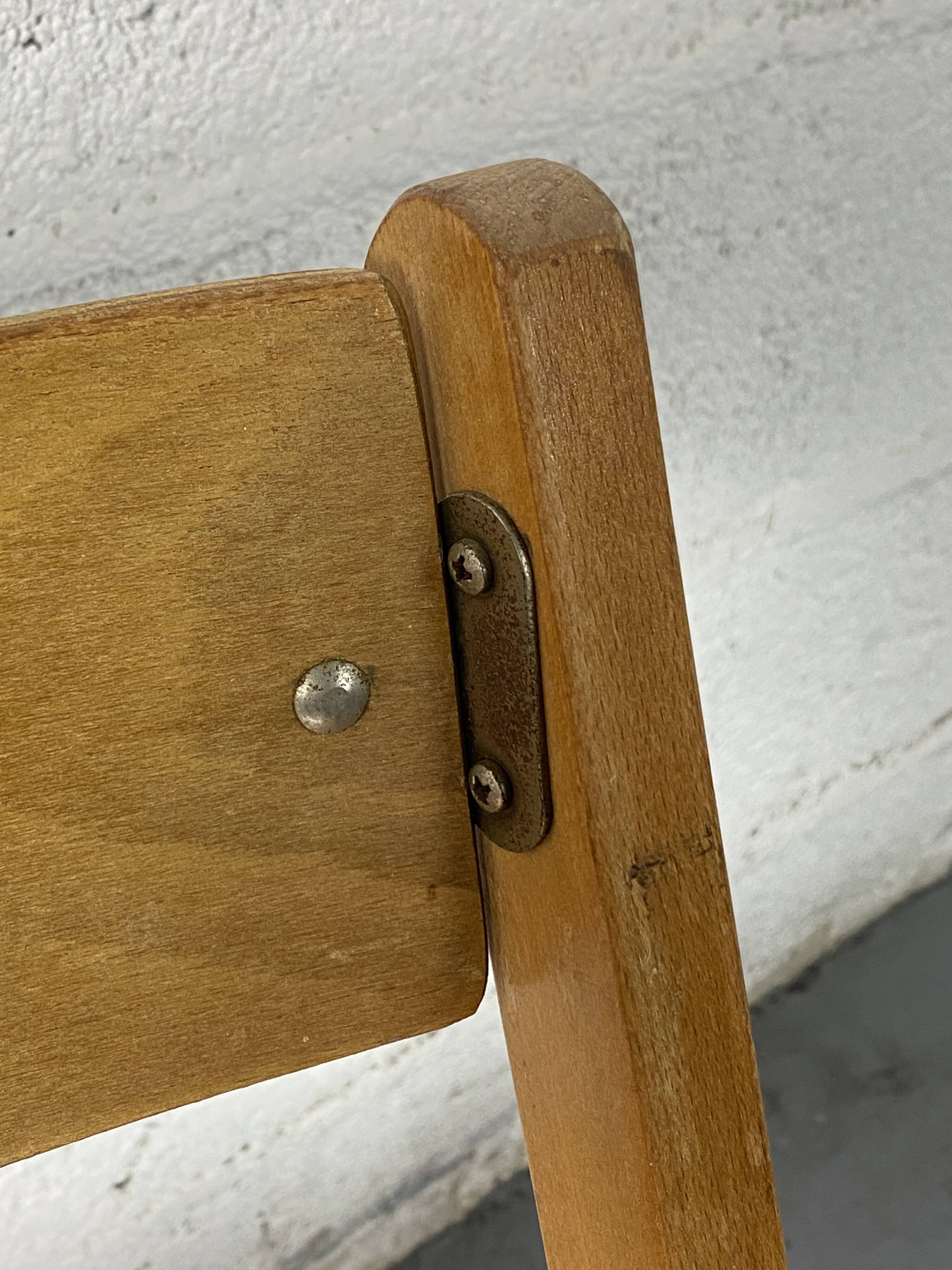 Pair of mismatched wooden folding chairs