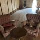 Living room with a three-seater sofa and two armchairs.