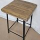 Old workshop stool in wood + wrought iron