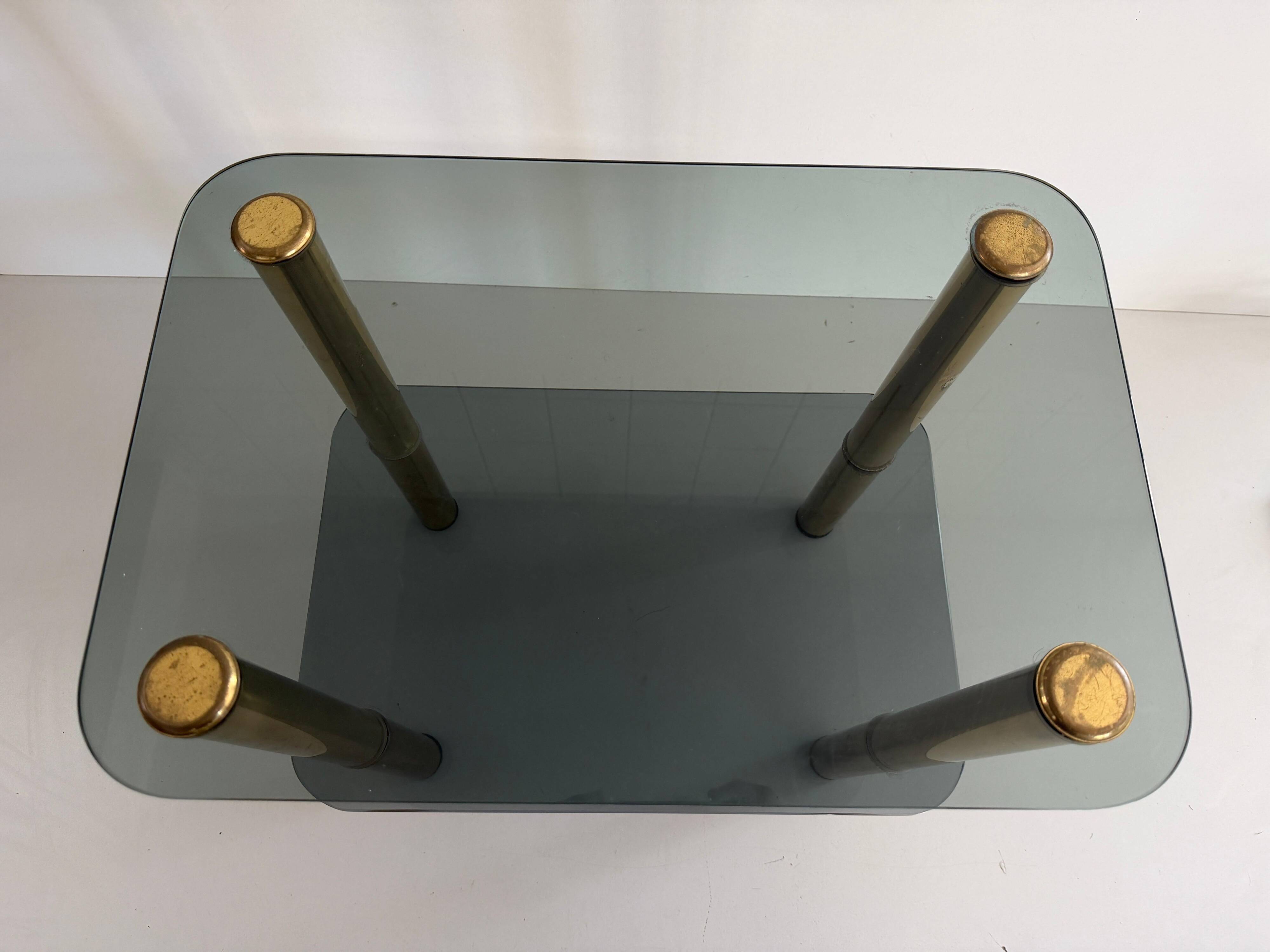 Side table in thick greenish glass with brass legs, Italy, 1960s.