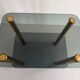 Side table in thick greenish glass with brass legs, Italy, 1960s.
