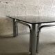 Table basse verre fumé et métal chromé années 70