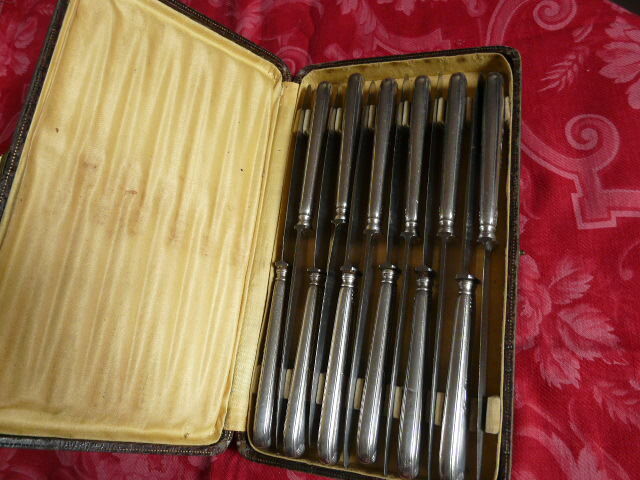 Series of 12 antique silver metal knives in their box