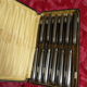 Series of 12 antique silver metal knives in their box