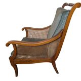 Regency style bergère armchair in wood, fabric and cane