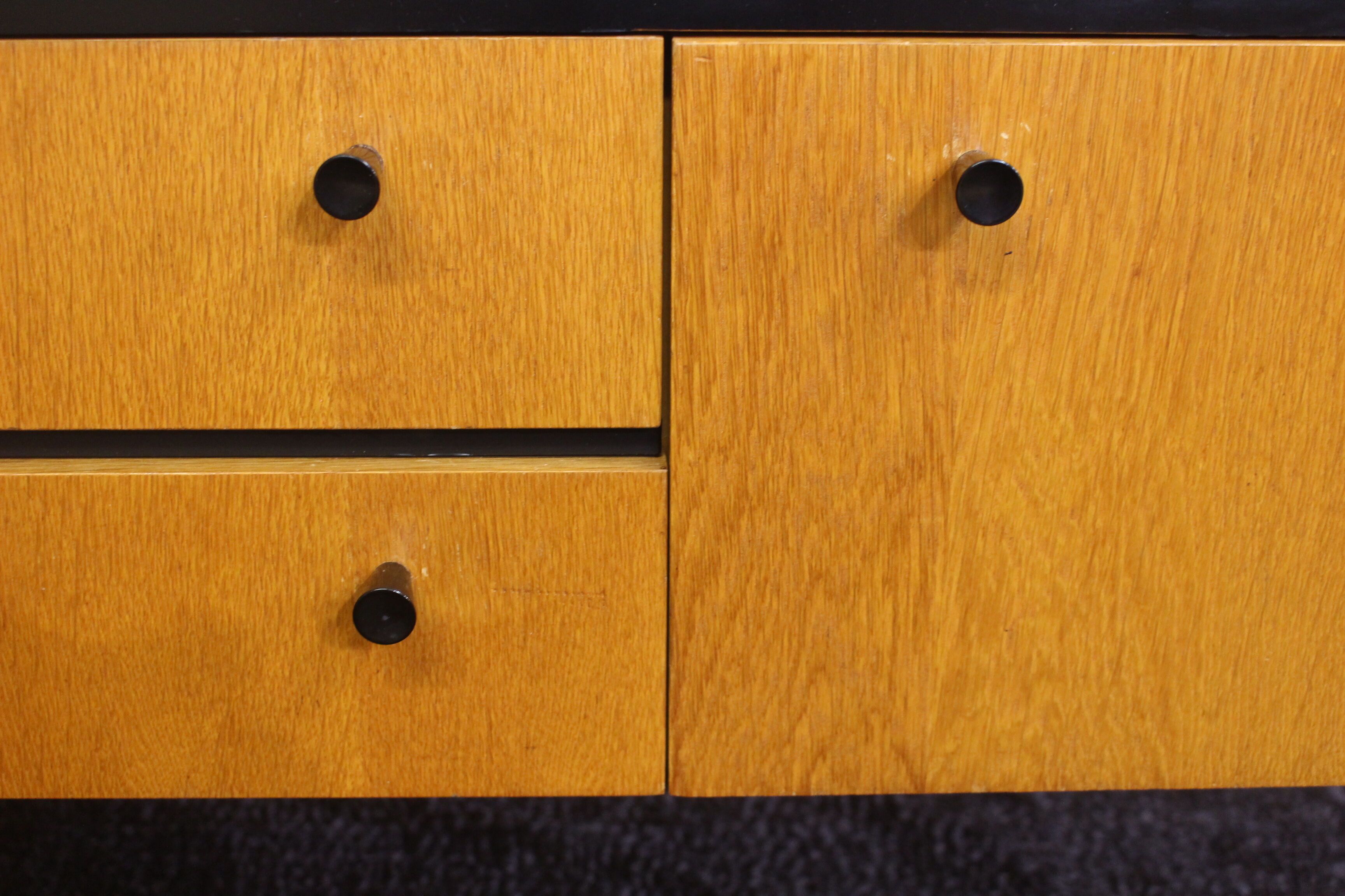 Black-gloved 50s varnished wooden sideboard