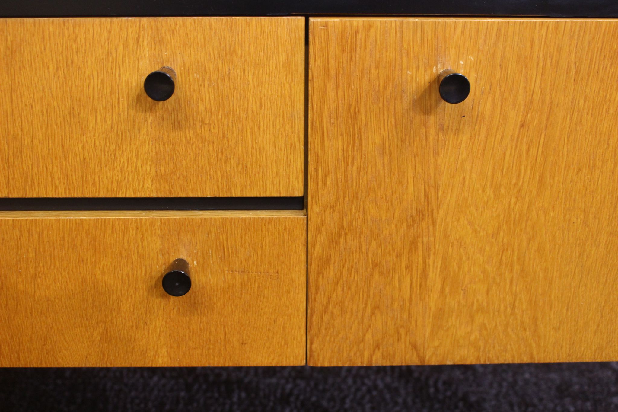 Black-gloved 50s varnished wooden sideboard