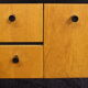 Black-gloved 50s varnished wooden sideboard