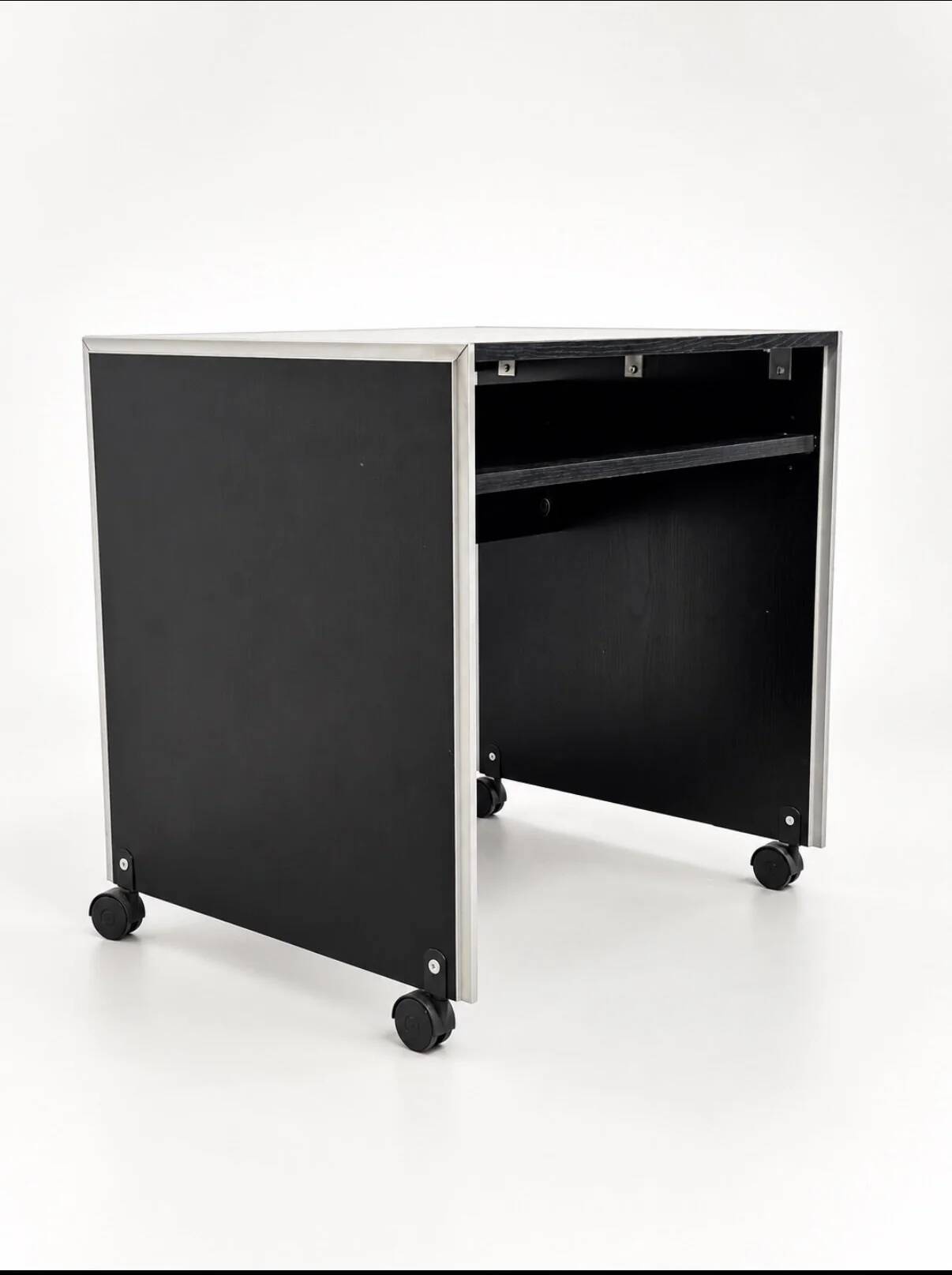 Vintage black computer desk on wheels with an aluminium edge.
