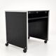 Vintage black computer desk on wheels with an aluminium edge.