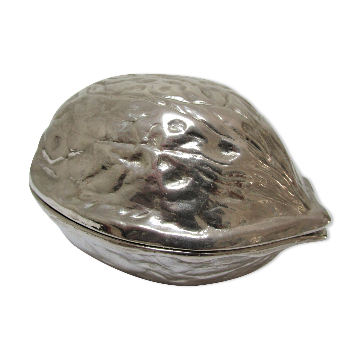 silver metal nutcracker in the shape of vintage walnuts