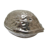 silver metal nutcracker in the shape of vintage walnuts
