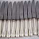 Ercuis Perles 24 knives, 12 table knives + 12 cheese knives in silver-plated metal, nearly new.