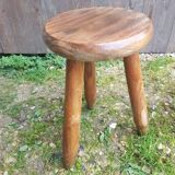 Old vintage wooden tripod milking stool