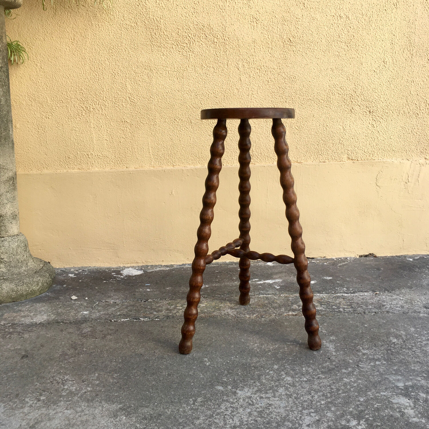 High tripod stool.