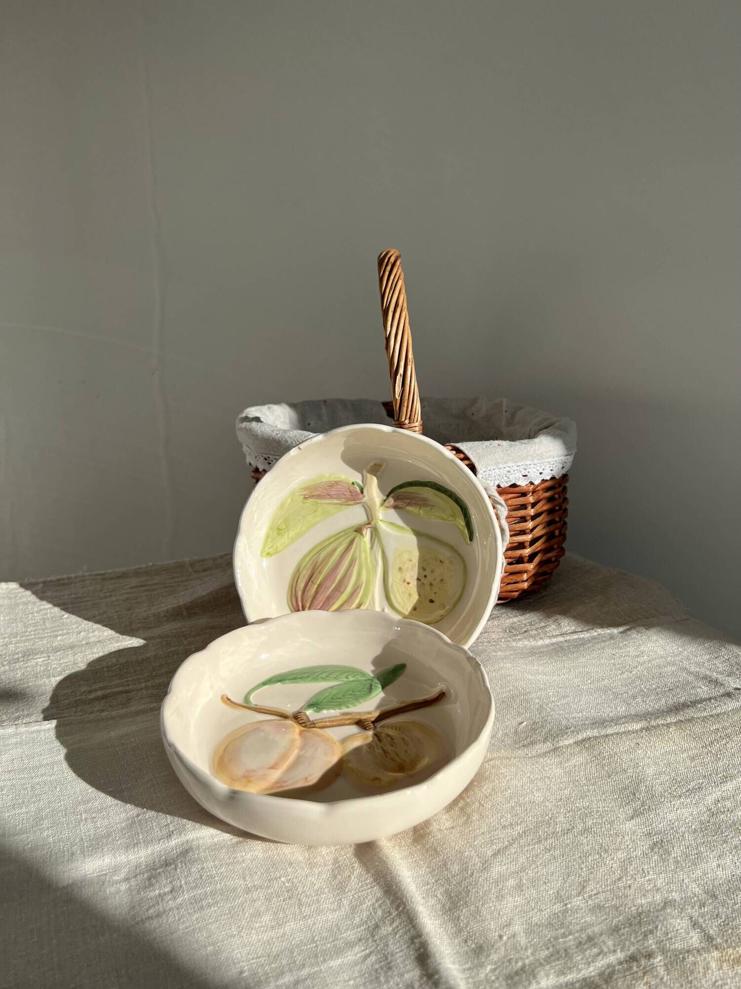 Pair of vintage hollow dessert plates in hand-painted slip, peach and fig fruit pattern